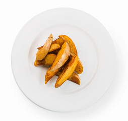 Crispy baked potato wedges closeup
