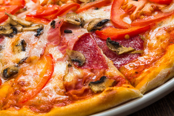 Delicious pizza with mushrooms and smoked chicken