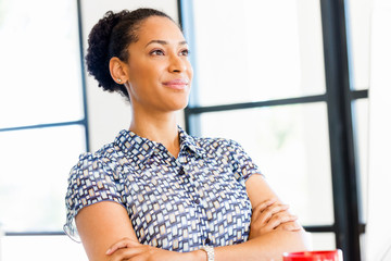 Portrait of smiling afro-american office worker sitting in offfice