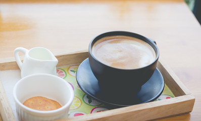 hot coffee with foam milk art in afternoon break
