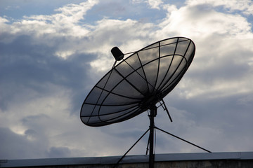 Satellite on the sky background.