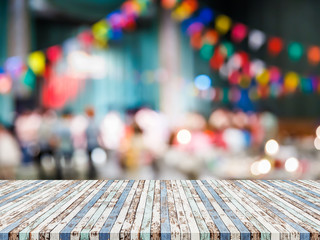 Empty wooden table top with blur background