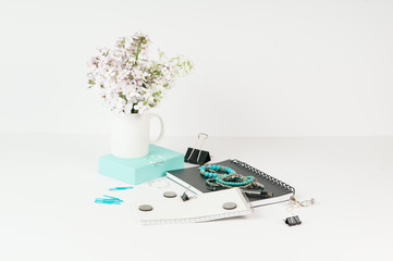 Feminine styled office desktop with teal accents