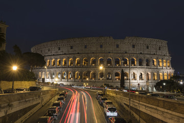 Fototapeta na wymiar Light trails at Colosseum in Rome at dusk, Italy