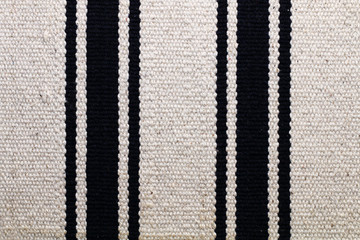 Woolen light gray fabric with several vertical blue strips