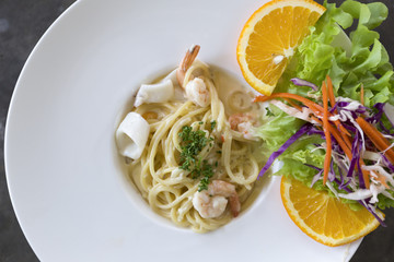 Spaghetti cream sauce with shrimp topping