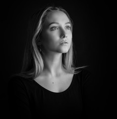 Black and white portrait of a beautiful young woman.