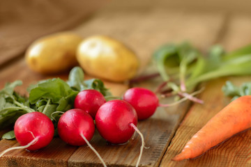 Rustic style. Fresh Radishes on the wooden table.