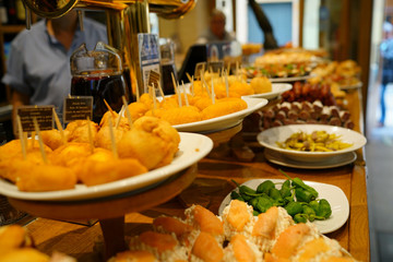 Fototapeta premium Spanish fingerfood and tapas set on bar counter