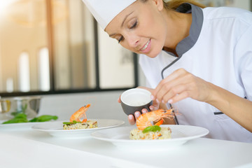 Chef preparing dish in professional kitchen