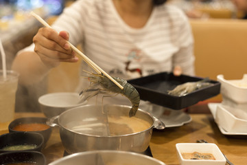 Happy girl with shabu shrimp premium