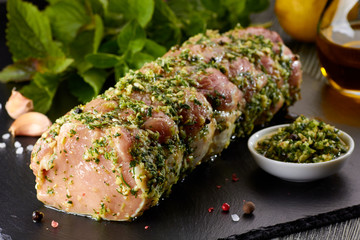 Raw pork loin with spices ready for baking