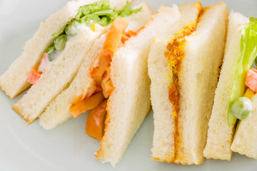delicious sandwich with ham vegeable bread on  white dish , home made sandwich, health food