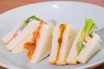 delicious sandwich with ham vegeable bread on  white dish , home made sandwich, health food