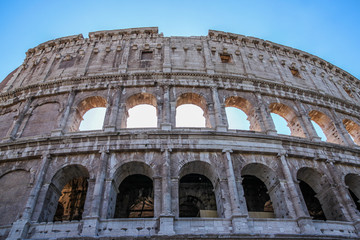 Obraz premium View of Colosseum in Rome and morning sun, Italy, Europe.