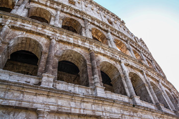 Fototapeta premium View of Colosseum in Rome and morning sun, Italy, Europe.