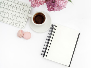 lilac flowers on workdesk female home office with keyboard and coffee white background top view mockup