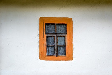 National Museum Pirogovo in the outdoors near Kiev. An old antique window in a vintage peasant white house in Ukraine.