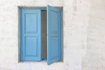Slightly open of blue wooden window