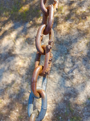 Welded and oxidized iron chain