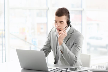Handsome young man working in office © Africa Studio