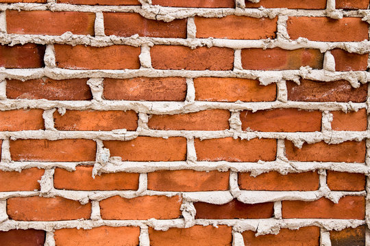 Brick And Mortar Background. Red Brick Wall With Fresh Mortar Background