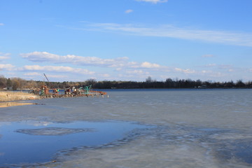 The beginning of spring. Ice on the lake. After the winter. Blue sky.  Stunning landscape and view.