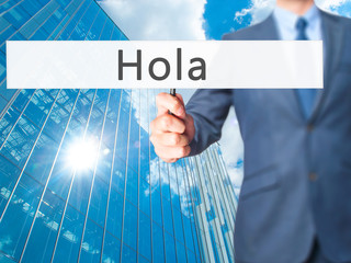 Hola - Businessman hand holding sign © netsay