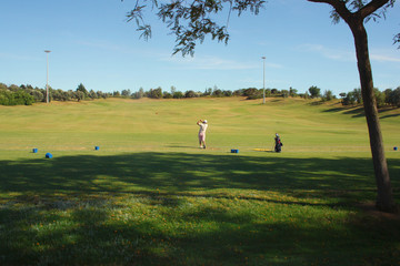 a man plays Golf at Park Golf course