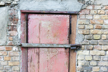 metal door in garage brick wall background