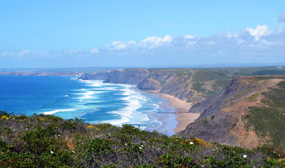 Beautiful West Coast of Algarve between Praia do Amado and Cabo de Sao Vincente (Costa Vicentina) with clouds