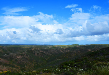Obraz premium Clouds over West Coast of Algarve between Praia do Amado and Cabo de Sao Vincente (Costa Vicentina)