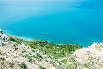 Blue sea and rocks. Rocky coast on ocean.