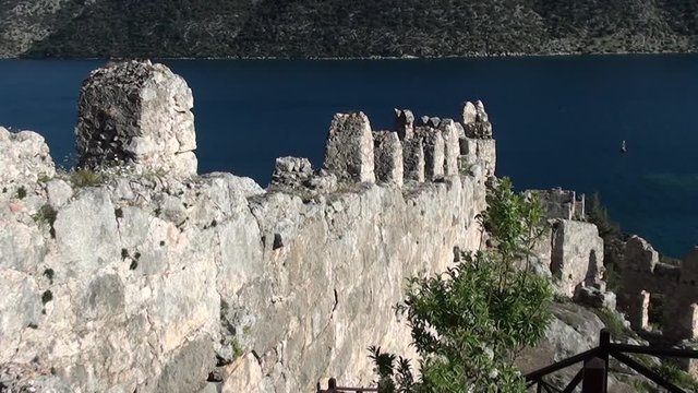 SIMENA, Turkey &ndash; March 17, 2013: Fortress wall and sea view