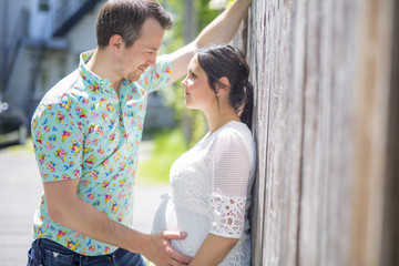 Pregnant couple portrait neighborhood