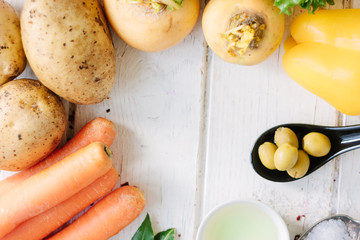 Top view of vegetables, olives and spices.