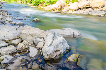 Background of Carpathian mountain river with long exposure