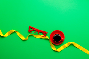 Cup of coffee and stylish glasses