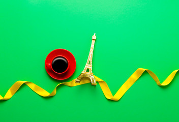 Cup of coffee and Eiffel tower toy