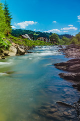 Naklejka na ściany i meble Background of Carpathian mountain river with long exposure