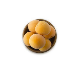 Bowl with apricots isolated on white background. Ripe apricots with copy space for text. Top view