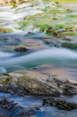 Background of Carpathian mountain river with long exposure