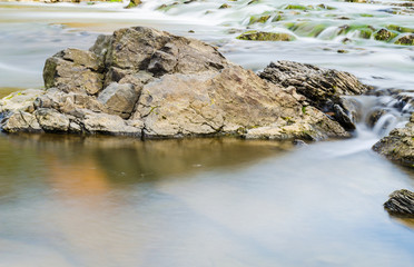 Background of Carpathian mountain river with long exposure