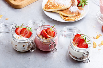 Healthy breakfast with natural greek yogurt, muesli and berries