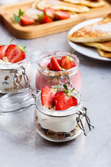 Healthy breakfast with natural greek yogurt, muesli and berries