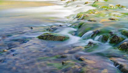 Background of Carpathian mountain river with long exposure