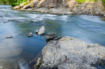 Background of Carpathian mountain river with long exposure