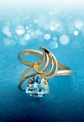 Elegant female jewelry ring with blue topaz