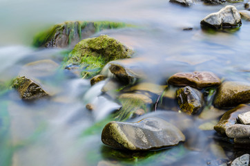 Background of Carpathian mountain river with long exposure