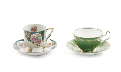 Beautiful vintage tea cups and saucers collection, isolated on a white background.